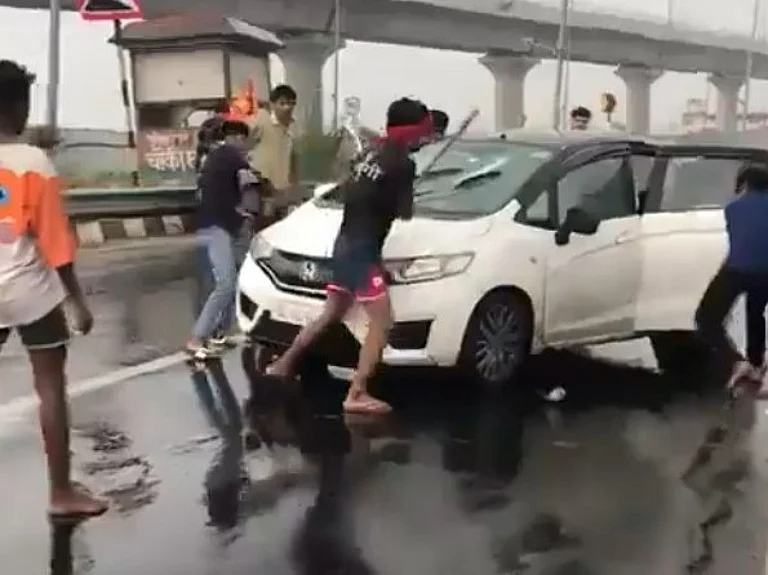 One of the videos shows the Kanwariyas raising slogans around the damaged car.
- X/@Delhiite_